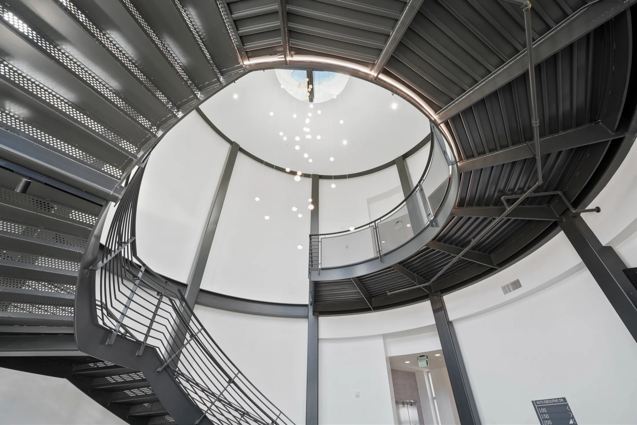 Looking up the circular steel stair tower at 4475 Executive Drive, San Diego